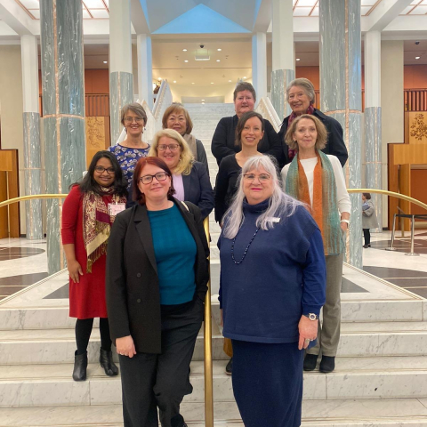 The delegation on the steps inside the Parliament House foyer